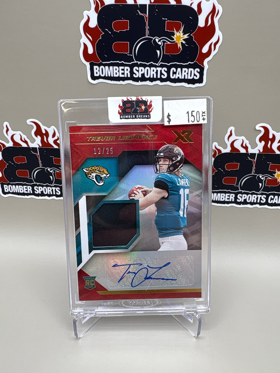 Trevor Lawrence 2021 Panini XR Red Jersey Auto RC 12/25