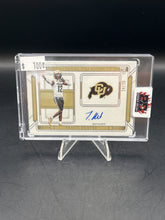 Load image into Gallery viewer, Travis Hunter 2025 Panini National Treasures Collegiate Team Logo Signatures Auto /25 #TLS-THR
