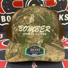Load image into Gallery viewer, RealTree APX Brown Camo Premium Bomber Sports Cards Hat
